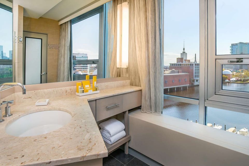 Refresh in a spa-like bath with bright city views.