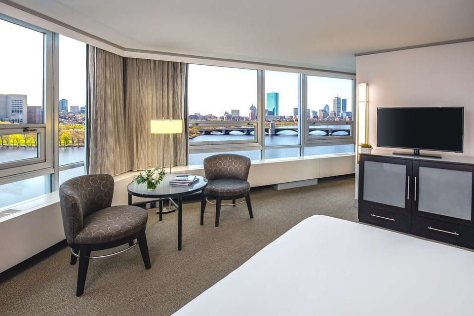 Wake up to sunlit river views from your plush bed.