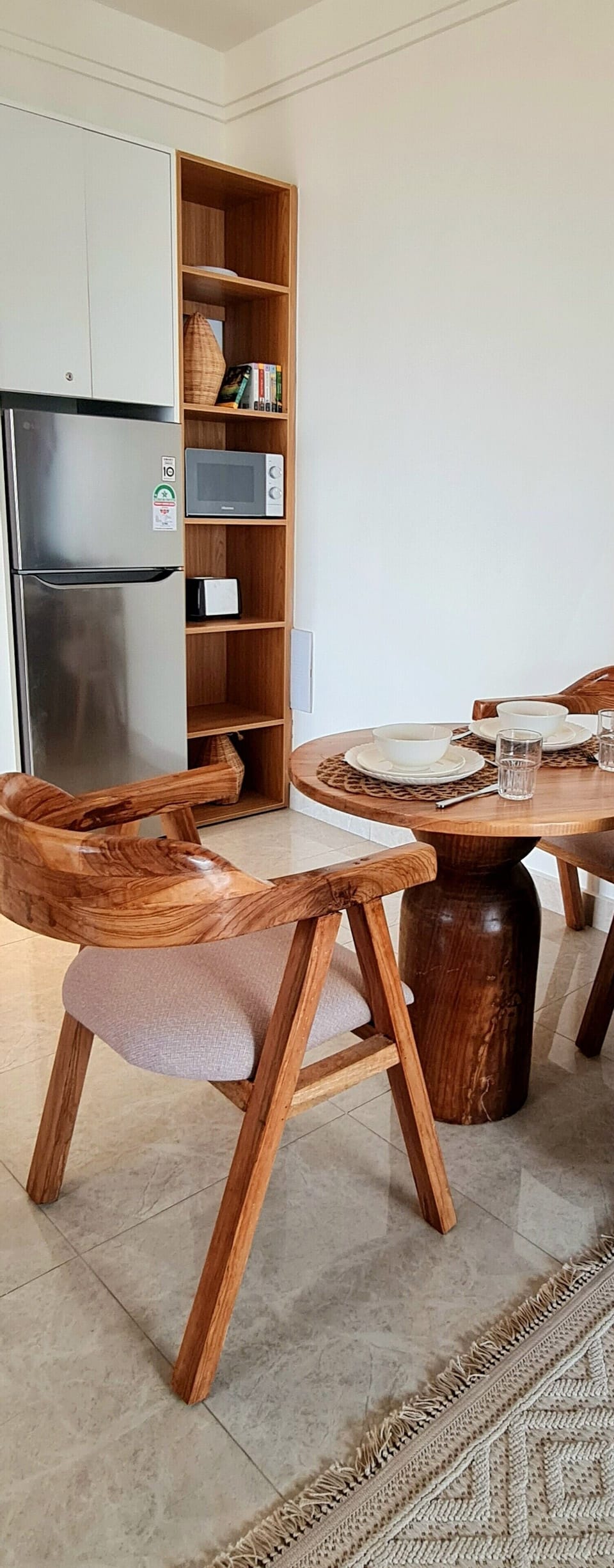 dining space with a cozy book corner perfect for relaxed meals or quiet moments