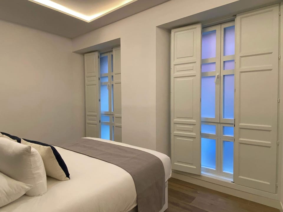 Peaceful bedroom with natural light.