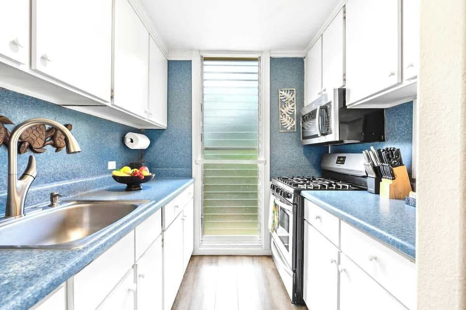 Everything you need for an easy stay: Enjoy the convenience of a full kitchen with a stove, microwave, and plenty of counter space.