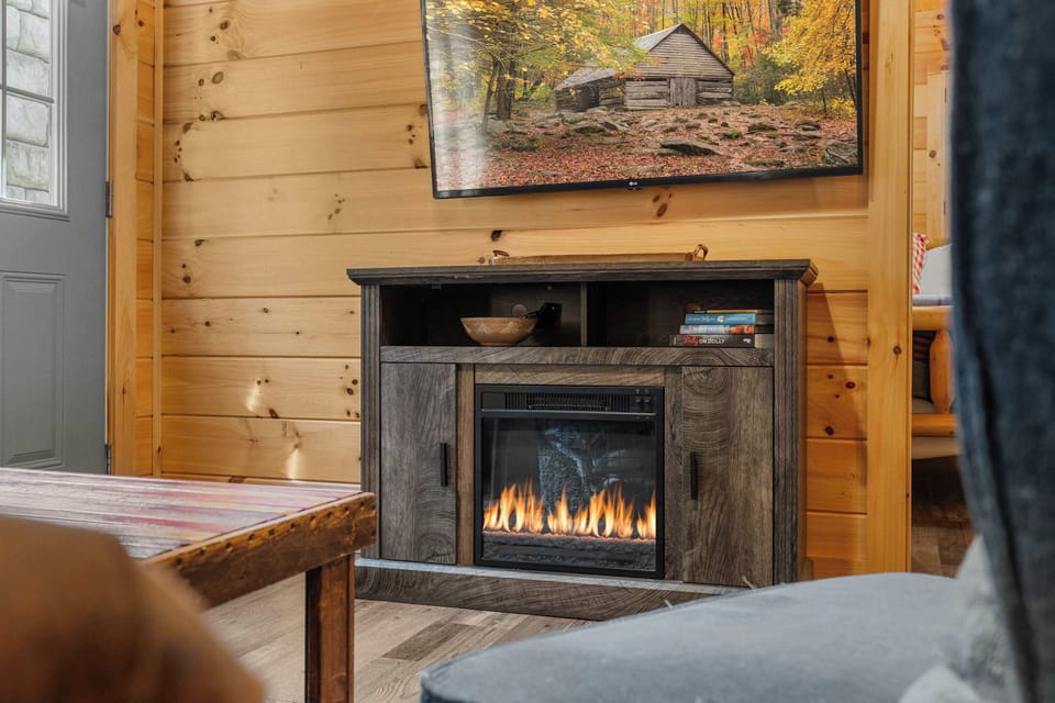 Bright and inviting, gather around the fireplace for unforgettable memories!