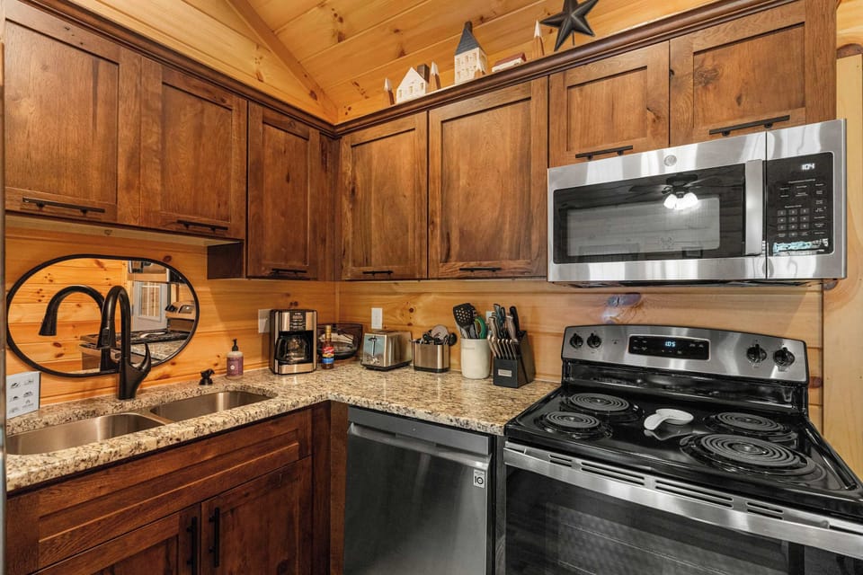 Modern appliances and charming decor make cooking a delight in this inviting space!
