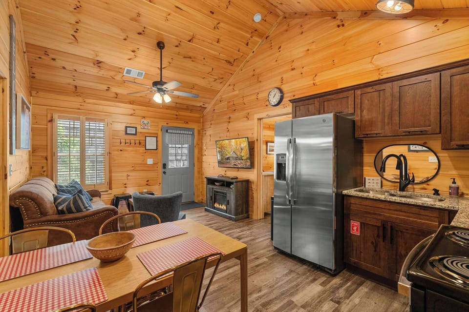 Enjoy gathering around the sleek fireplace and watching shows on the big screen!