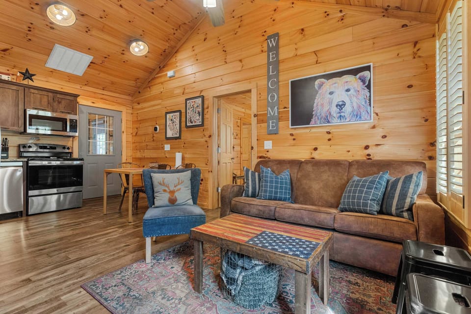 An inviting Living Room awaits! Rustic charm meets modern comfort with wood accents, funky decor, and inviting seating!