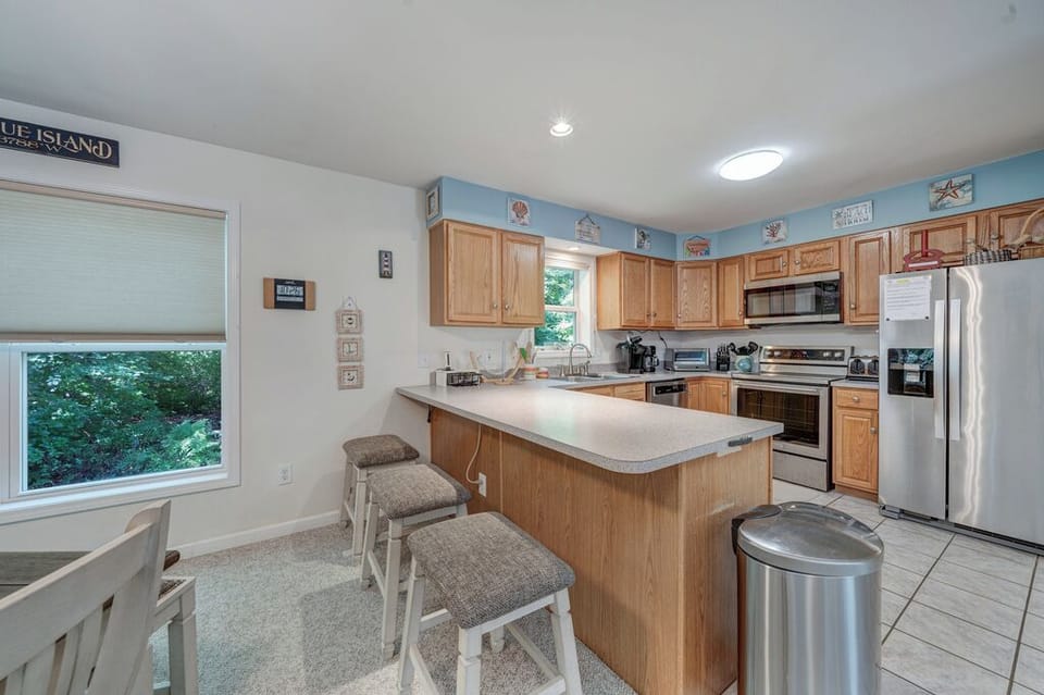 The Kitchen, with Breakfast Bar, is well-equipped with all the comforts of home.