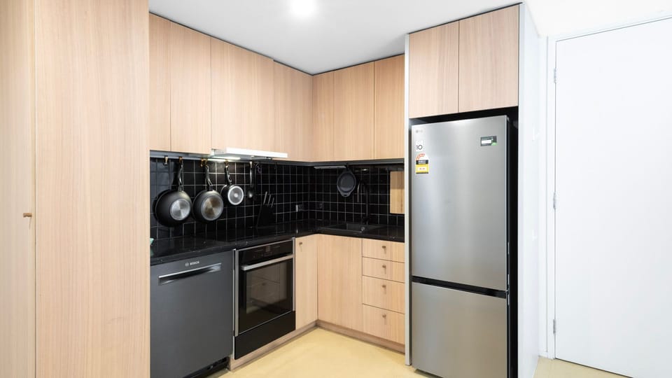 Modern kitchen with ample storage, stainless steel appliances, and essentials.