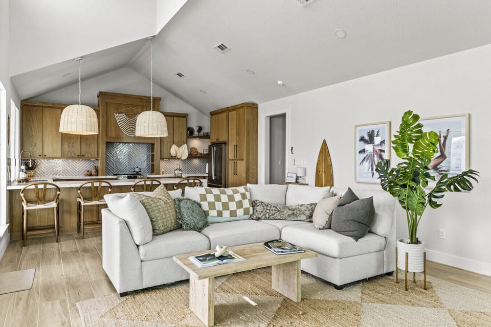 Bright coastal vibes meet comfort and relaxation in this open living space