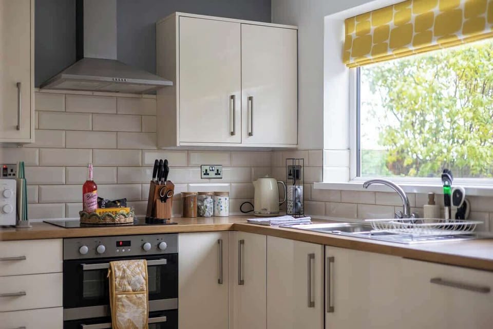 “Cook with ease in this clean, spacious kitchen — fully equipped for all your needs.”