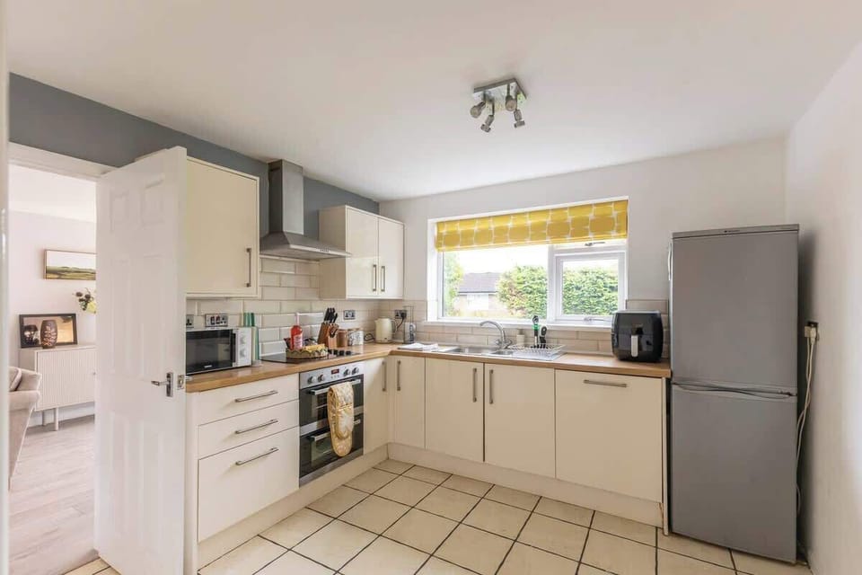 “Cook with ease in this clean, spacious kitchen — fully equipped for all your needs.”