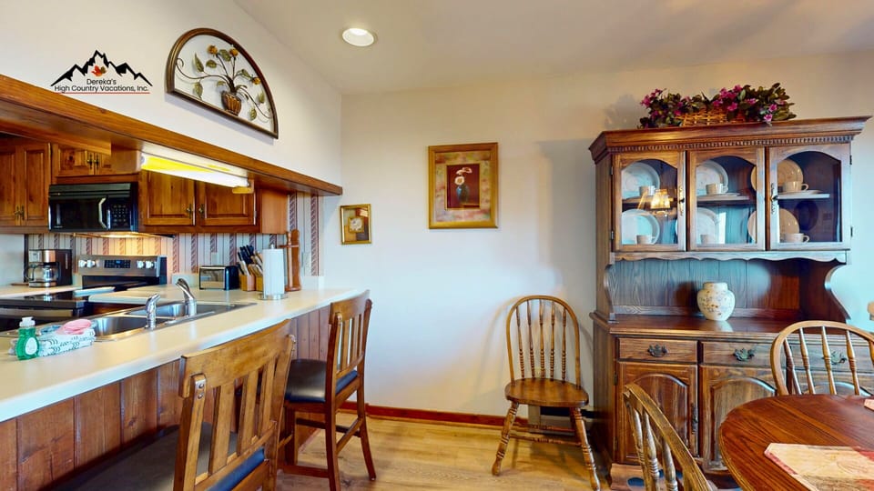 Kitchen with breakfast bar seating & dining area