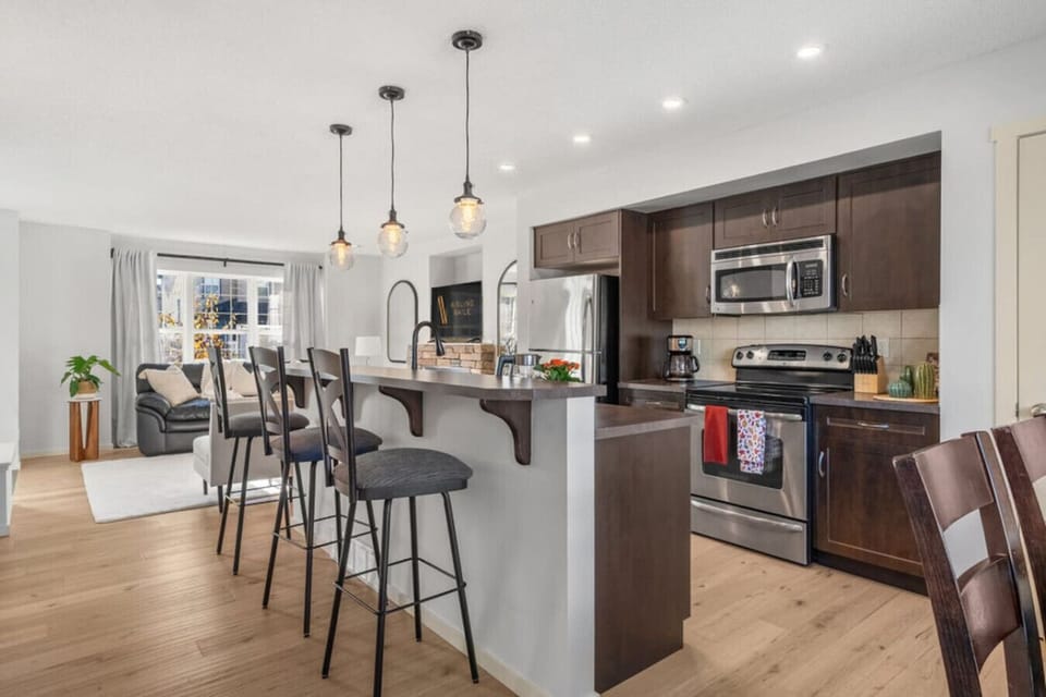 Full kitchen with a drip coffee maker, air fryer and a waffle maker. Ground coffee, tea, sugar, ketchup, mustard and relish are provided.