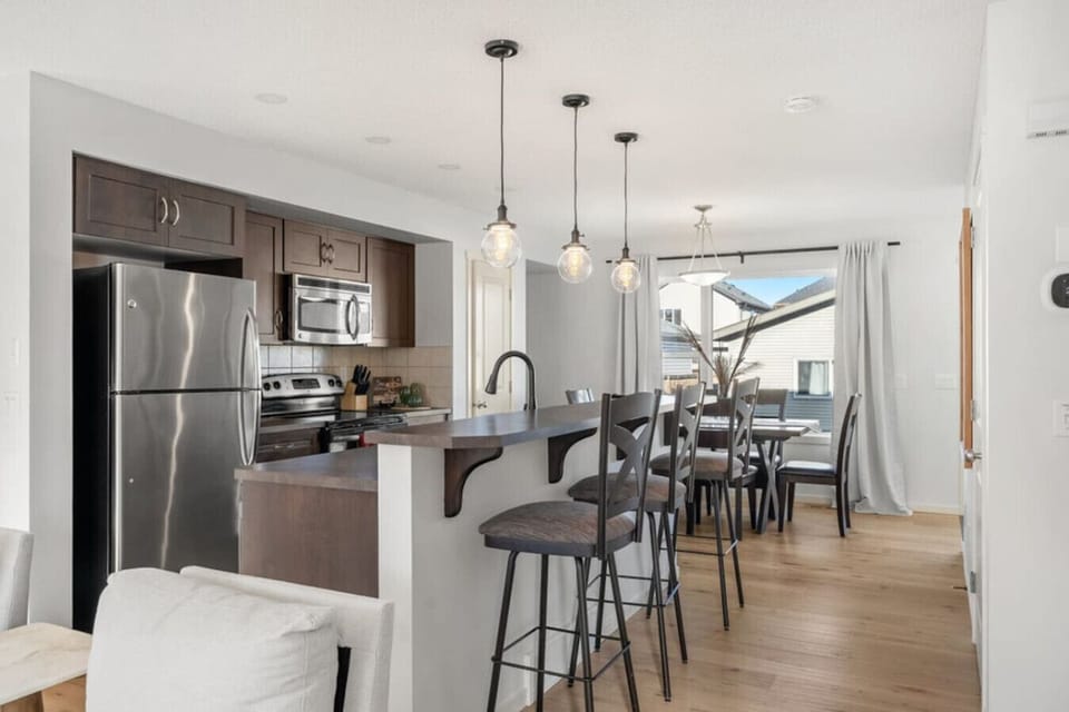 Full kitchen with a drip coffee maker, air fryer and a waffle maker. Ground coffee, tea, sugar, ketchup, mustard and relish are provided.