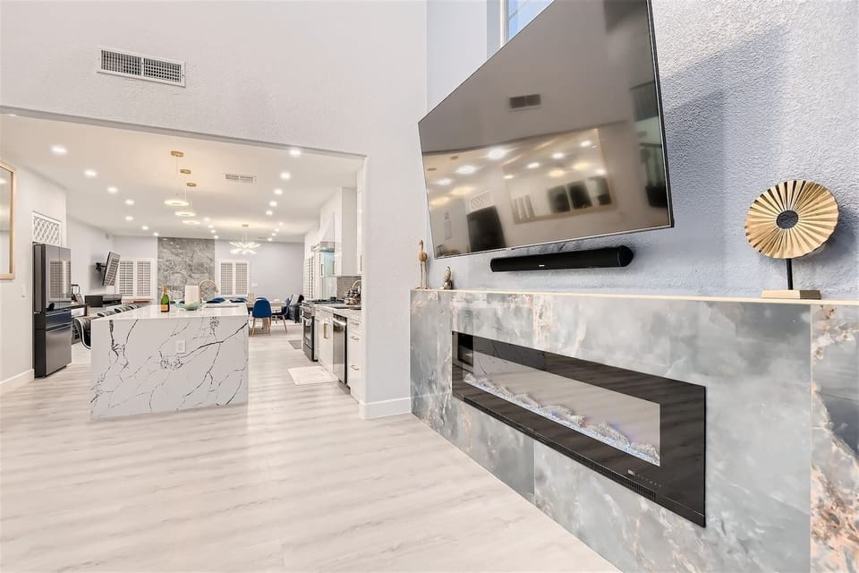 Enjoy watching TV or listen to music from the living room or swivel the TV to watch from the oversized island while eating or drinking at the the massive island.