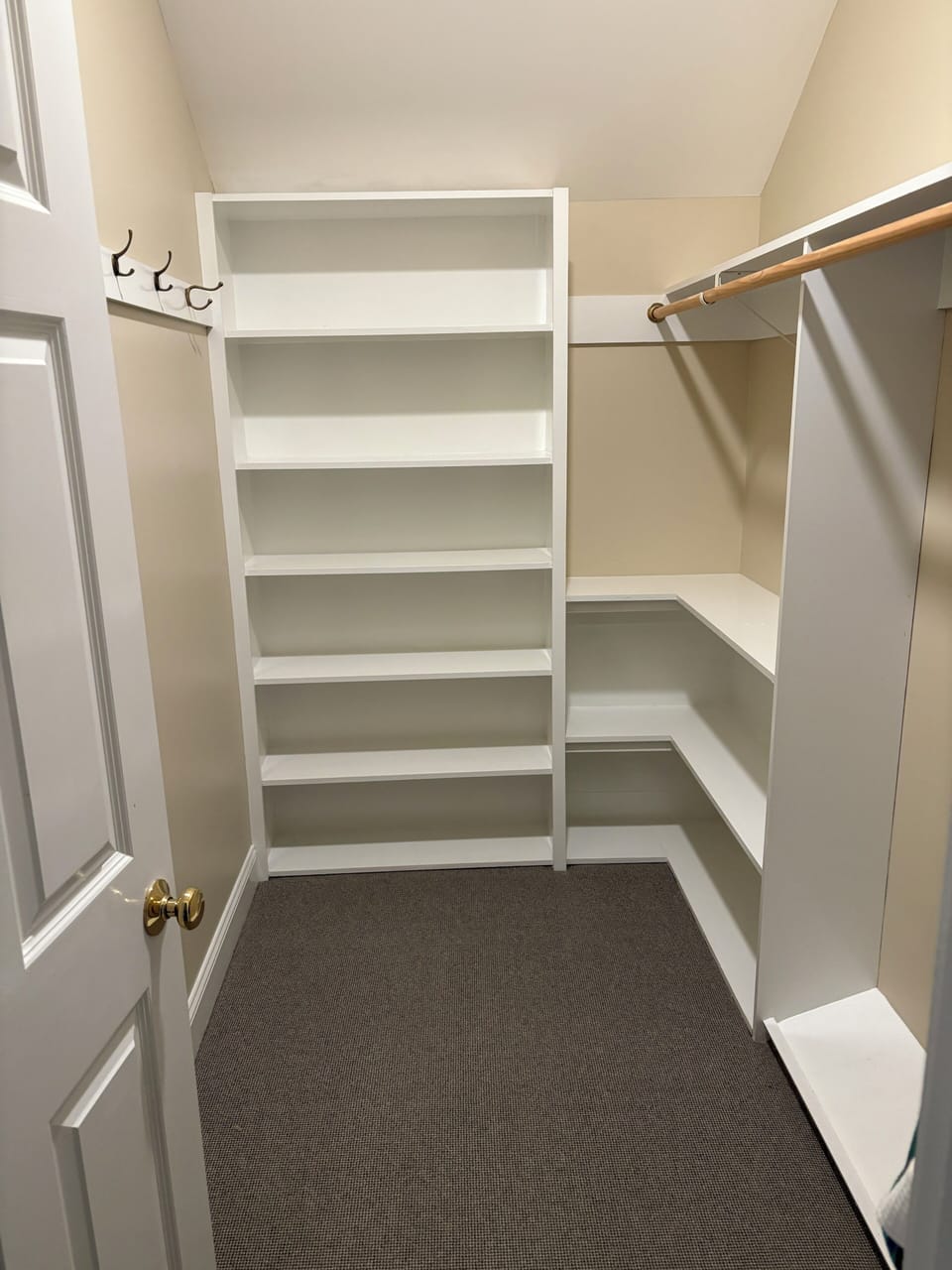 Primary bedroom walk in closet