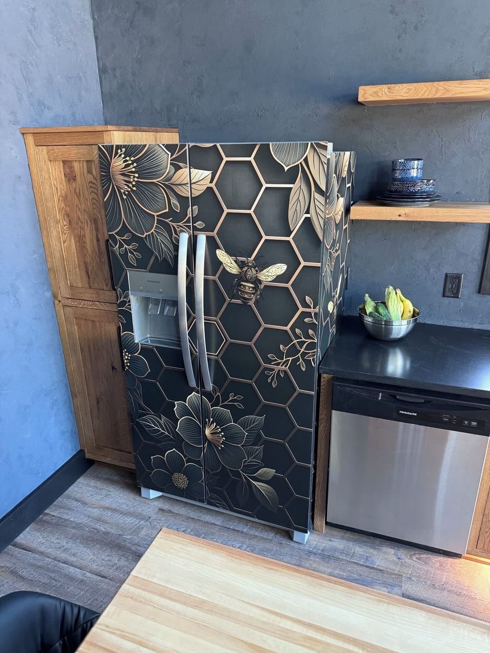 Unique accent on the Chalet Blu refrigerator, we love bees