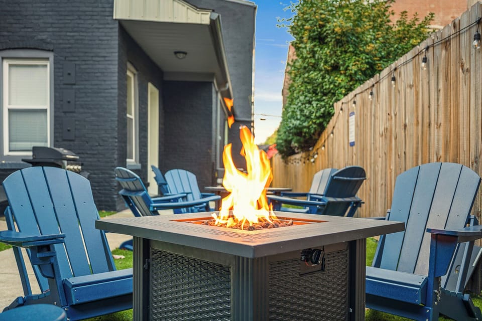Fenced Patio: Cozy fire pit with Adirondack seating!