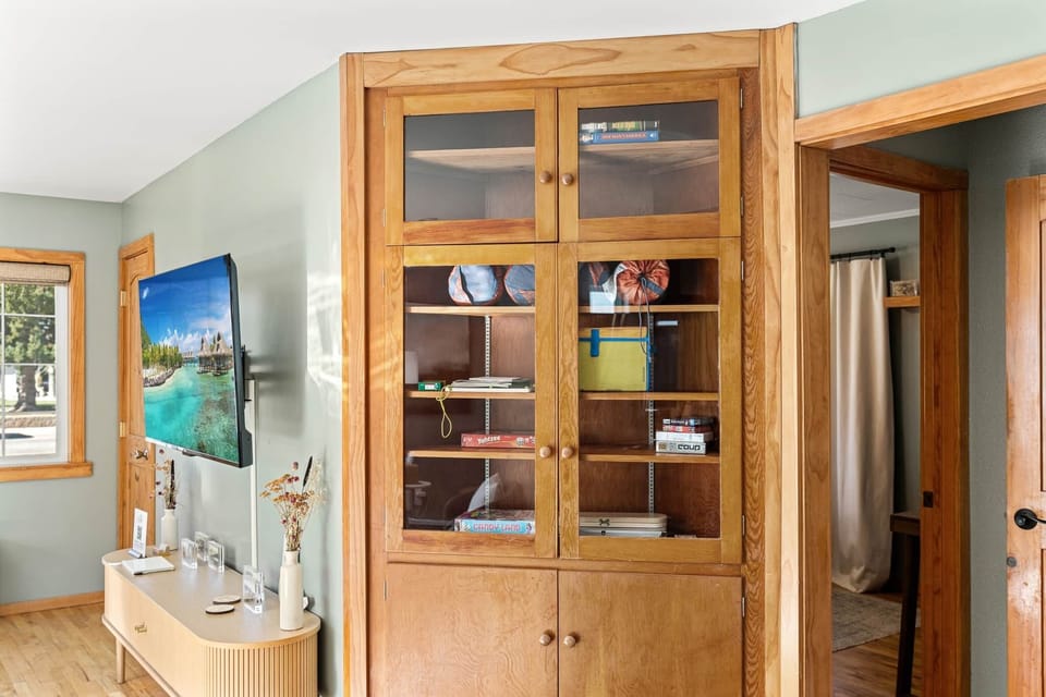 Character-filled built-in shelving, providing plenty of space for pantry items or long-term stay ess