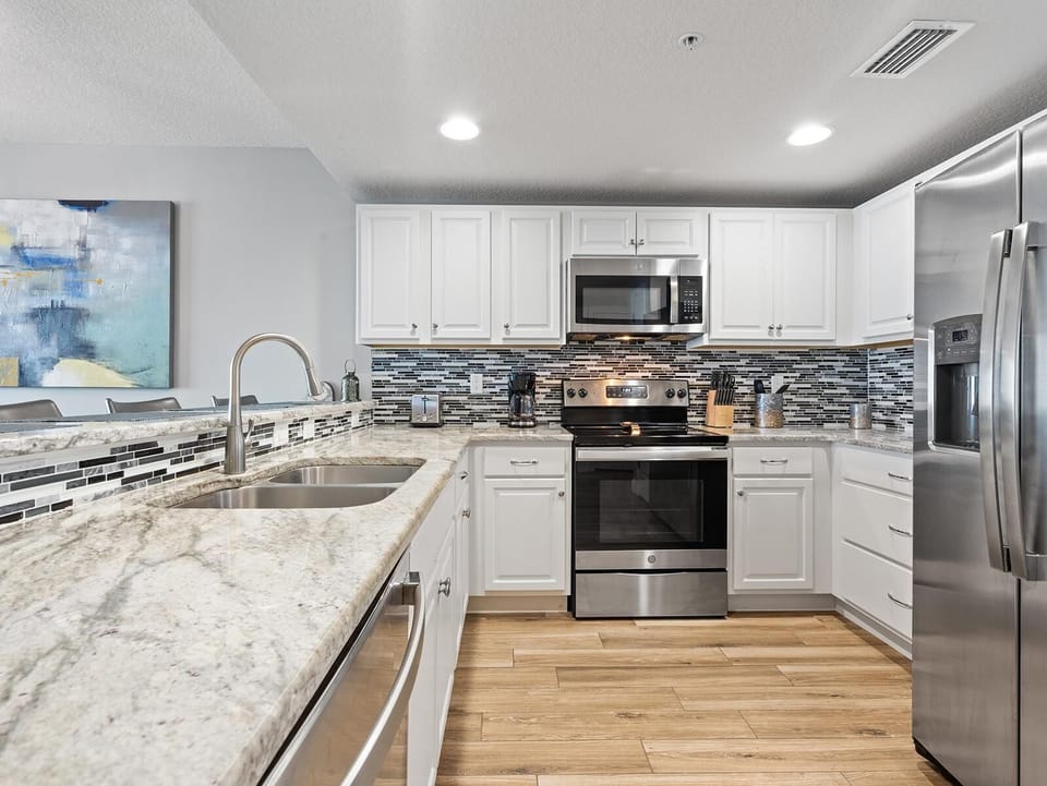 Modern kitchen with granite countertops and stainless steel appliances