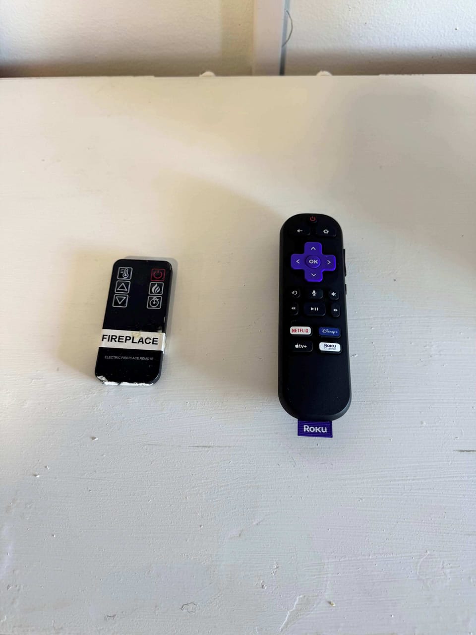 The small remote is for the electric fire place the other controls all functions of the tv plus your streaming Roku.