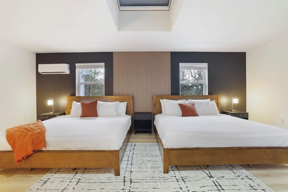 The roomy primary bedroom has 2 king beds providing a comfortable sleeping space