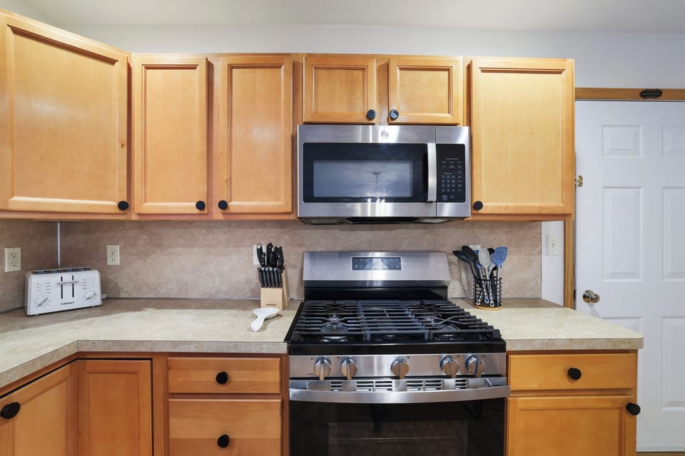 Our spacious & stocked kitchen offers full size appliances & ample counter space