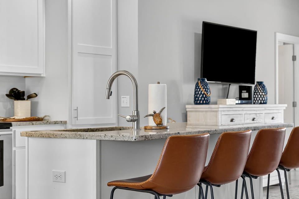 The open layout flows seamlessly into the dining area, making it easy to serve and socialize.