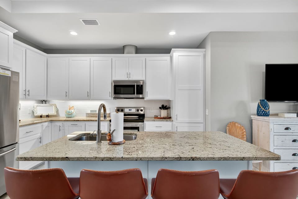 Outfitted with modern appliances and stocked with cooking essentials, it's ready for everything from quick snacks to full family dinners.ds