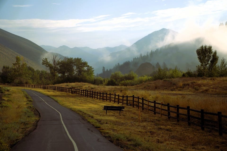 Enjoy a quiet morning ride on   Lake Creek Path. The gentle sounds of the creek, shaded paths, and mountain views make it the perfect start to your day