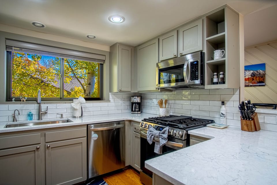 Cook with ease in this well-appointed kitchen featuring modern appliances, ample counter space, and everything you need for home-cooked meals.
