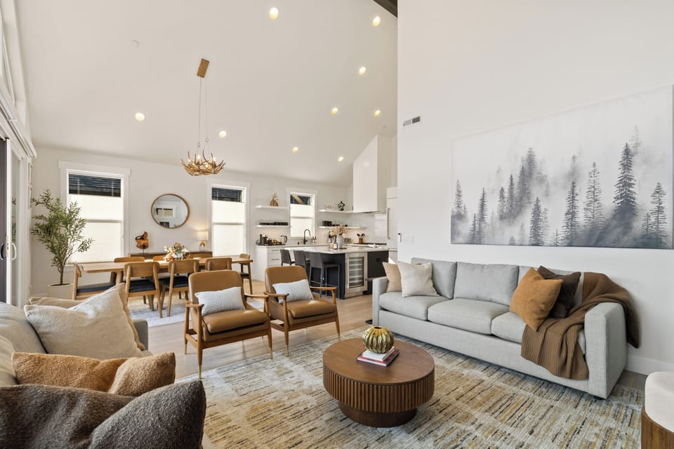 A bright open space where the living, dining, and kitchen flow together.