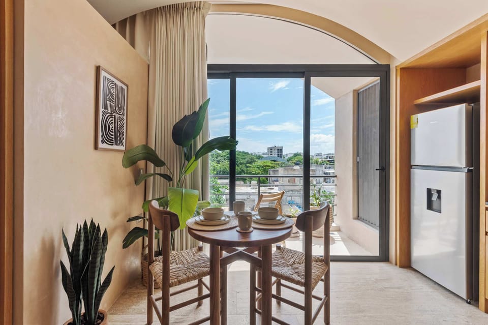 Dining area for two people with access to the private balcony
