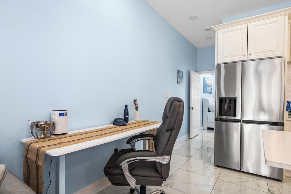 Dedicated workspace with desk and office chair.