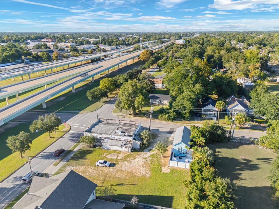 Wider aerial view showing location and nearby main roads.