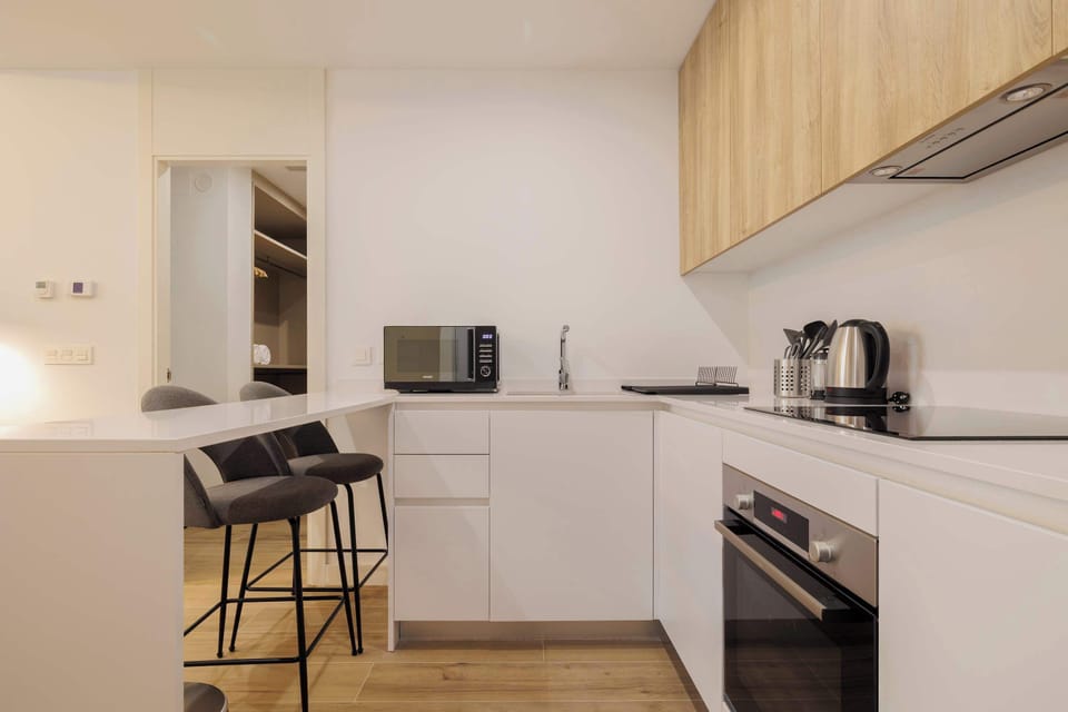Kitchen counter with stools.