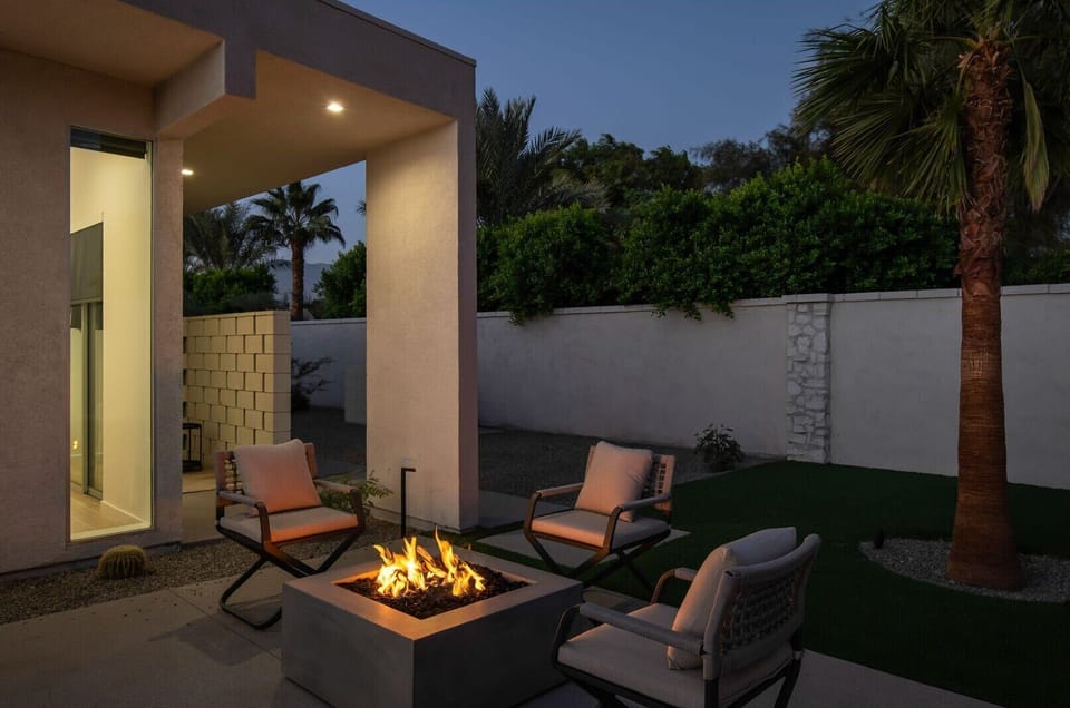 Enjoy a peaceful evening around the gas fire pit, perfectly lit for quiet conversation under the desert sky.