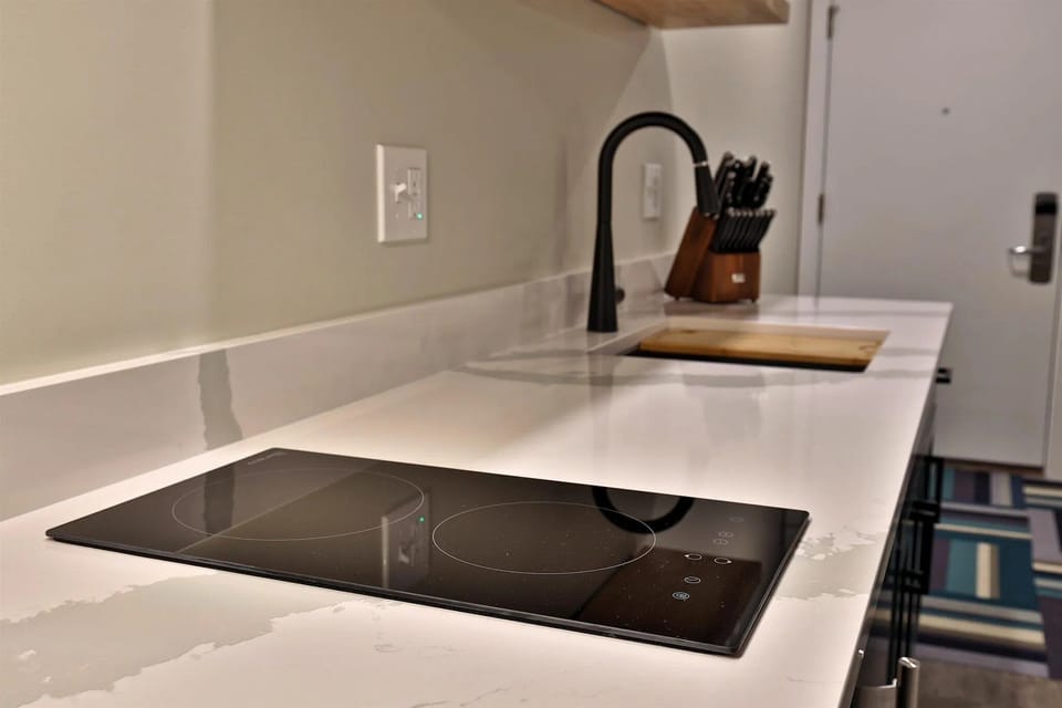 The two-burner induction cooktop. Sleek, fast, and perfect for morning coffee or light meals.
