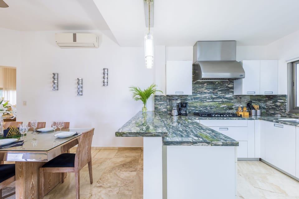 Modern dining setup for shared meals and relaxed Caribbean mornings.