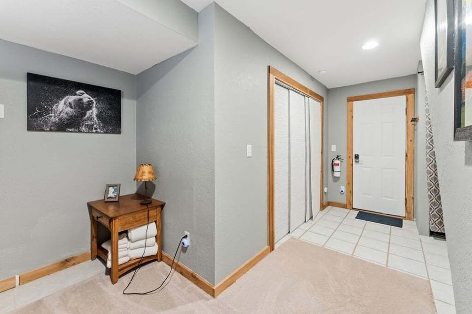 Your welcoming entryway with organized storage and fresh towels makes arriving feel like coming home.