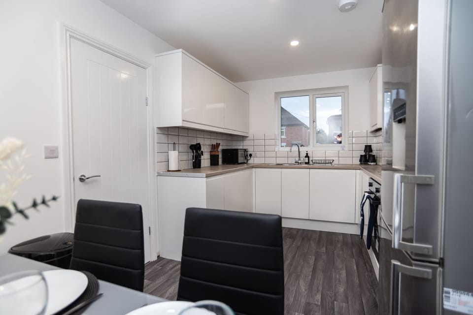 Bright, spacious brand-new kitchen with fully integrated appliances — perfectly equipped for easy cooking and a comfortable home-from-home stay.