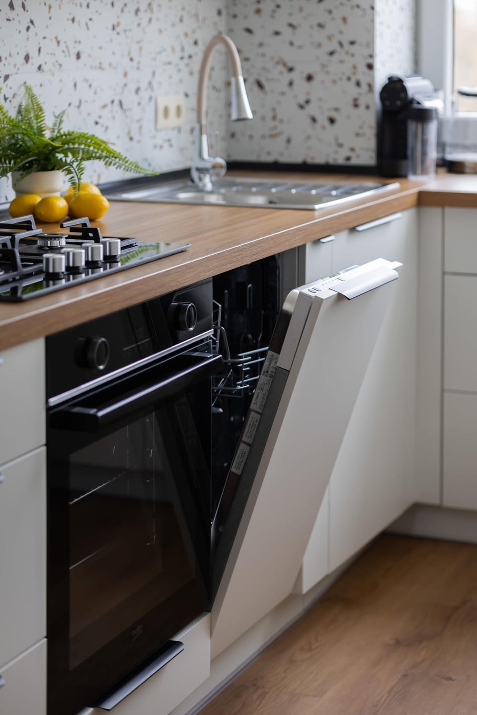The kitchen has been equipped with an oven and high-quality appliances.
