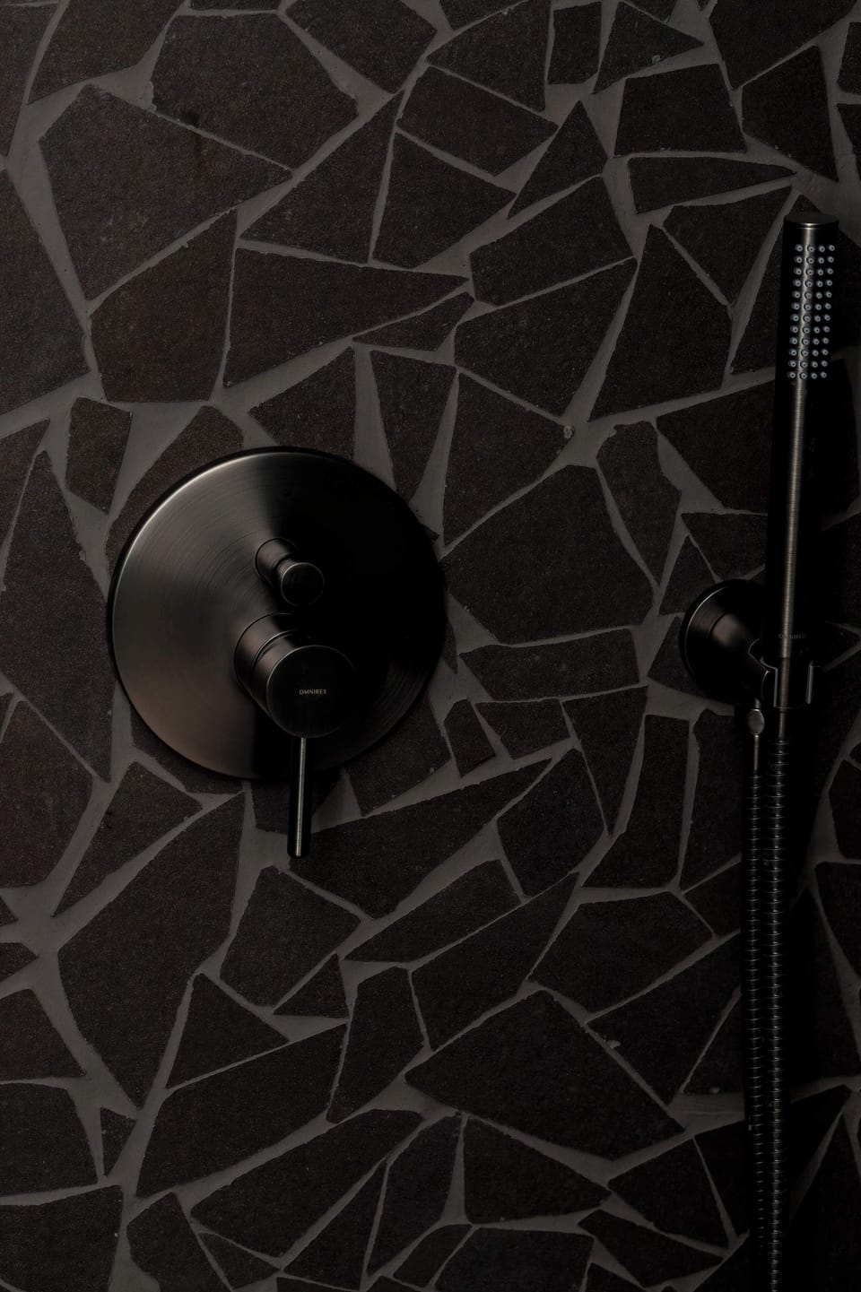 Close-up of the black fittings in the bathroom.