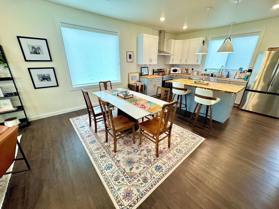 Dining room and kitchen area. Fully stocked kitchen w/pantry essentials. 