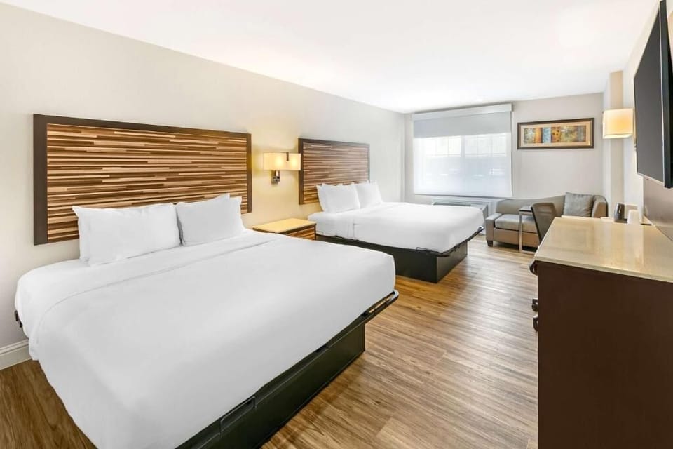 Wake up to a spacious room with two plush beds.