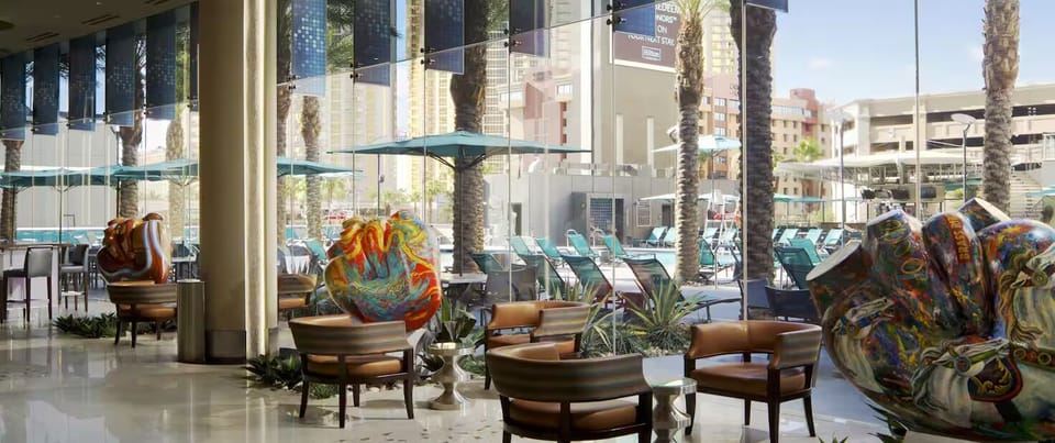 Settle into stylish lounge seating with bright poolside views.
