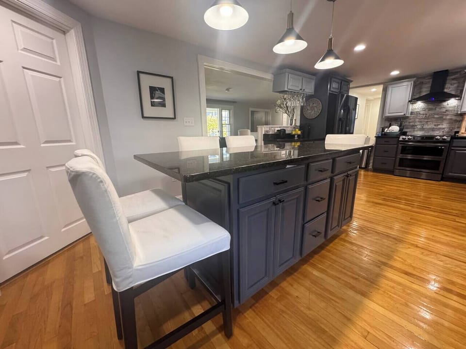 Kitchen + Living Area View Sleek, open-concept design with clean lines, stylish lighting, and easy flow between cooking, dining, and relaxing spaces.