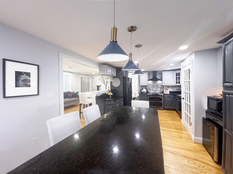Kitchen  Bright, modern kitchen with large island, new high-end appliances, and an open layout that connects beautifully with the main living space.