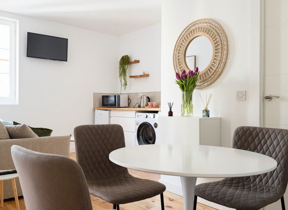 Open-plan living area with kitchenette and seating