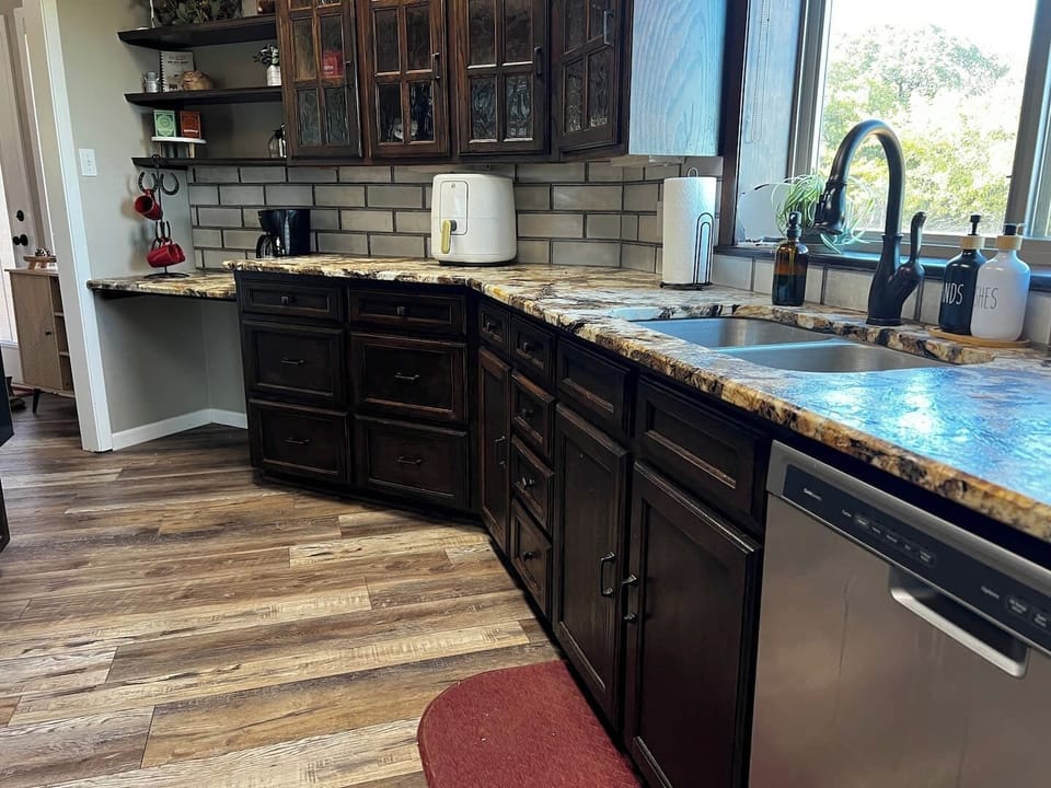 Fully equipped kitchen with stove, fridge, microwave, toaster, and dishwasher. Enjoy cooking in a bright, open layout that flows into the living space—perfect for long stays or remote work.