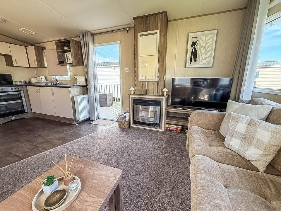 There is enough space for the whole family to relax in this living room in Suffolk.